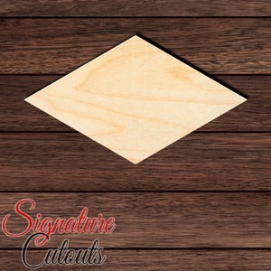 May include: A light-colored, unfinished wooden cutout in the shape of a diamond. The surface displays a natural wood grain pattern with visible light brown tones. The cutout is flat and features sharp, pointed corners at the top, bottom, and sides.