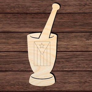 May include: A light-colored wooden mortar and pestle cutout featuring a laser-engraved design of the Puerto Rican flag on the front of the mortar. The flag design consists of a triangle with a single star and vertical stripes.