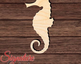 May include: A light-colored wooden seahorse cutout with a smooth surface and a curled tail. The seahorse features a distinct snout, a textured dorsal ridge, and a curved body shape. The text Signature Cutouts is visible in the bottom left corner.