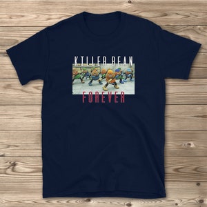 May include: A navy blue t-shirt with a graphic of a group of cartoon beans dancing. The text "Killer Bean Forever" is printed on the shirt.