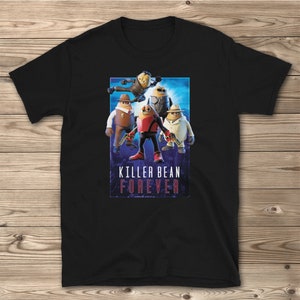 May include: Black t-shirt featuring a graphic of four cartoon characters in a superhero pose. The characters are wearing different outfits and holding weapons. The text "Killer Bean Forever" is printed below the characters.