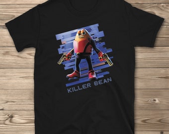 May include: Black t-shirt with a graphic of a bean-shaped character holding two guns. The character is wearing a red and black suit and has a blue background with the text "Killer Bean".