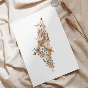 May include: A watercolor print of a floral arrangement in shades of brown, white, and beige. The flowers are arranged in the shape of a tree, with a butterfly perched on a branch.