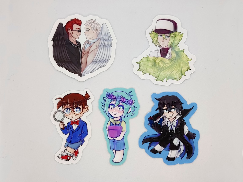 May include: Six illustrated stickers featuring various characters. The first sticker shows two men, one with red hair and black wings, the other with white hair and white wings. The second sticker shows a person with green hair and a white hat. The third sticker shows a person with brown hair and glasses holding a magnifying glass. The fourth sticker shows a person with green hair and a flower crown holding a purple pot. The fifth sticker shows a person with black hair and a black cape. The sixth sticker shows a person with green hair and a white hat.