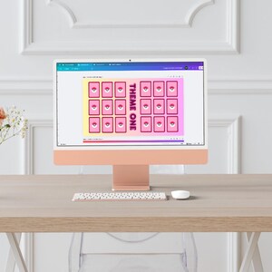May include: A computer screen displaying a pink and yellow digital design with a grid of 16 squares. Each square has a pink circle with a white eye inside. The text "THEME ONE" is in the center of the design.