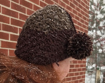 Brown toque with pompom