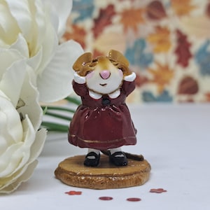 May include: A set of three ceramic mugs with a speckled, matte finish. The mugs are in shades of cream, light gray, and dark gray. Each mug has a simple, minimalist design and a rounded handle. Perfect for coffee or tea.