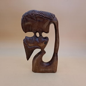 Teak Statue of Couple Kissing