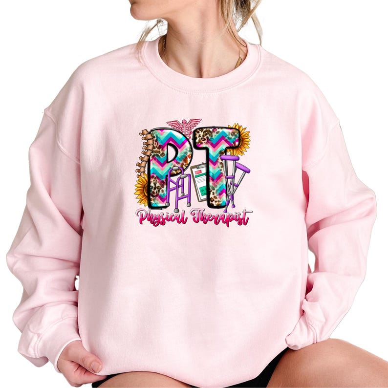 a woman wearing a pink sweatshirt with the word phi on it