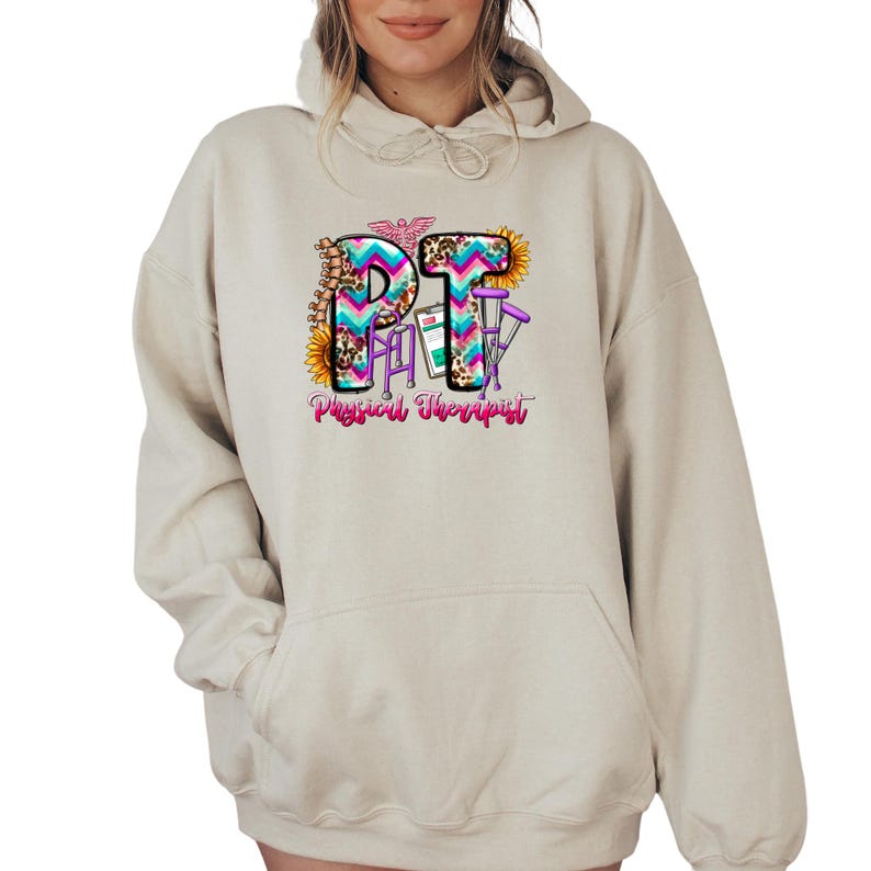 a woman wearing a white hoodie with the letter p on it