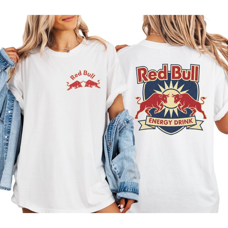 A woman wearing a white t-shirt with the Red Bull logo and a denim jacket.