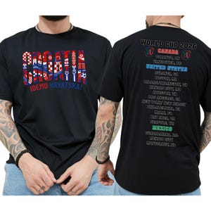 A black t-shirt with text and graphics printed on it, including the text "CRAZIA" and "IDEO HRVATSKA!" along with a list of locations and events related to the Croatia national soccer team.