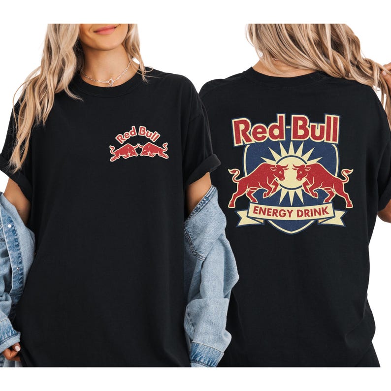 A woman wearing a black t-shirt with the Red Bull logo and a graphic of two bulls.