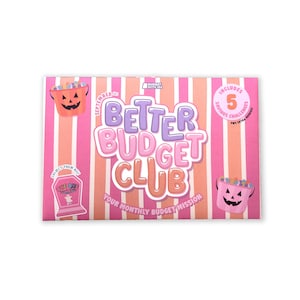 May include: A rectangular card with pink and white vertical stripes featuring the text Better Budget Club and Your Monthly Budget Mission. It includes illustrations of two jack-o'-lantern buckets, a tombstone graphic, and a circular badge.