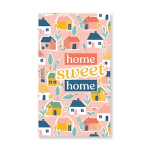May include: A pink background with a pattern of colourful houses and green leaves. The text "home sweet home" is written in a yellow, blue, and white font.
