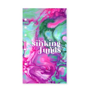 May include: A planner cover with an abstract marble design in shades of pink, green and blue. The text "sinking funds" is printed in white. The cover has a hole punch design on the left side.
