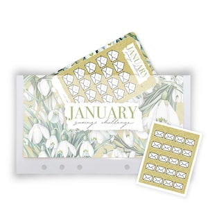 May include: A January savings challenge tracker card featuring a white snowdrop floral pattern on a gold background. The card displays the text JANUARY savings challenge and includes a grid of twenty small envelope icons for tracking financial goals.