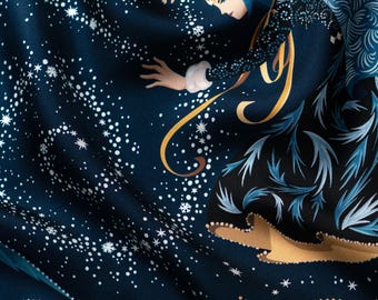 May include: Dark blue fabric with a celestial design featuring a woman in a blue dress and a starry night sky. The illustration includes white stars, snowflakes, and gold accents. The woman has a blue head covering and white fur trim.