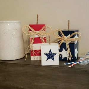 Wooden firecrackers.  These blocks range in sizes.  July 4th.  Red white and Blue.  Independence
