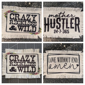 May include: Four burlap patches with black text and floral accents. The patches read "CRAZY RECKLESS & WILD", "mother HUSTLER 24-7-365", "CRAZY RECKLESS & WILD", and "LOVE WITHOUT END, amen".