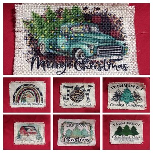 May include: A set of ten burlap Christmas ornaments with various designs, including a truck with a Christmas tree, a rainbow, a Christmas tree with a leopard print ornament, a Christmas tree with a red barn, and a Christmas tree with the text "Wild About Christmas".