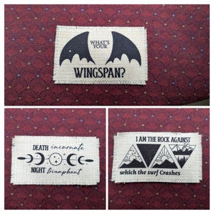 May include: Three fabric patches with black and white designs. The first patch features a bat silhouette with the text "What's your wingspan?" The second patch features a crescent moon and stars with the text "Death incarnate, night triumphant." The third patch features a mountain range with the text "I am the rock against which the surf crashes."