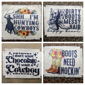 May include: Four burlap patches with different sayings and images. The first patch has a silhouette of a cowboy riding a horse with the text "SHH...I'M HUNTING COWBOYS". The second patch has a pair of cowboy boots with the text "DIRTY BOOTS MESSY HAIR happy heart". The third patch has the text "I don't want Chocolate I want a Cowboy". The fourth patch has a pair of cowboy boots with flowers and the text "BOOTS NEED KNOCKIN'".