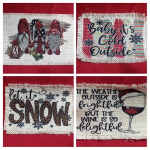 May include: Four burlap Christmas ornaments with different designs. The first ornament features three gnomes with red hats and white beards. The second ornament has the text "Baby it's Cold Outside". The third ornament has the text "let it SNOW" with a leopard print design. The fourth ornament has the text "The weather outside is frightful but the wine is so delightful" with a glass of red wine.