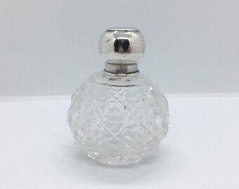 Antique sterling silver topped cut glass perfume / scent / dressing table bottle of bulbous form - with original stopper