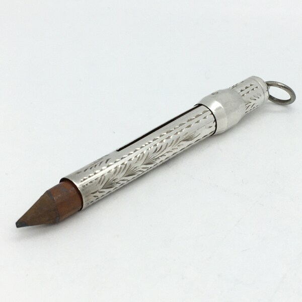 Small vintage sterling silver retractable pencil holder fob with engraved detailing