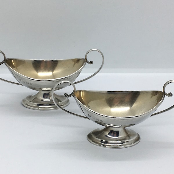 Pair of antique solid sterling silver twin handled boat shaped salt servers / cellars