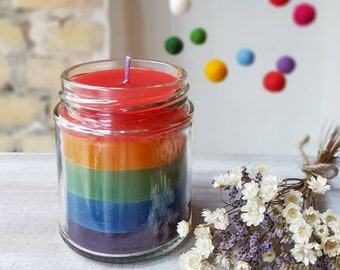 Candle in a glass, poured in layers, pastel and rainbow colors, partly made from recycled wax, lantern