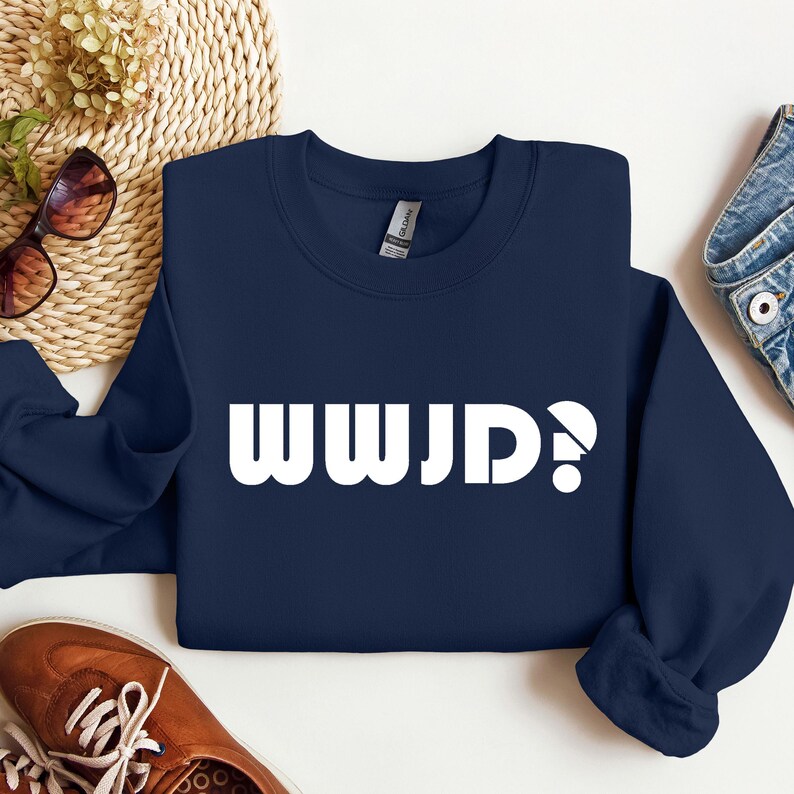 May include: Navy blue sweatshirt with white text that reads "WWJD?"
