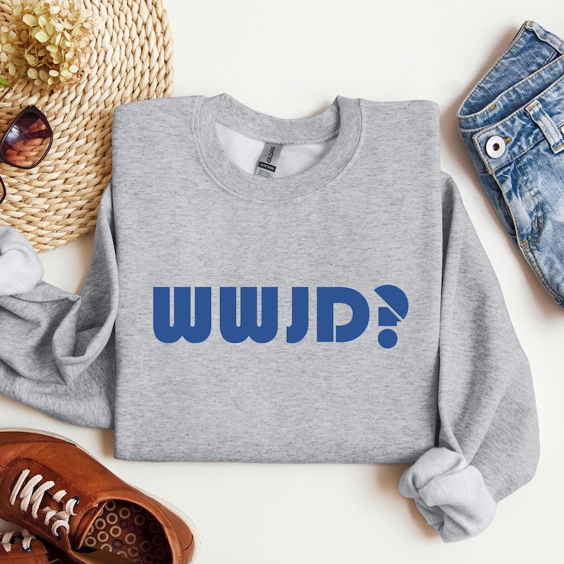 May include: Gray sweatshirt with blue text that reads "WWJD?"