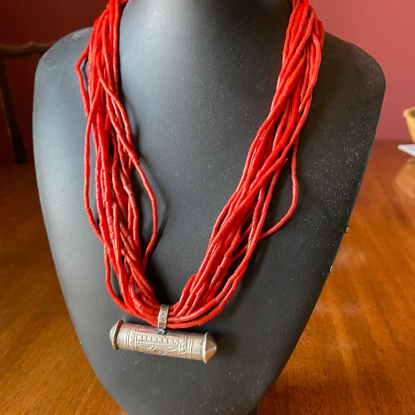 Nagaland shell or sustainable coral stained beads multi strand with silver amulet case.
