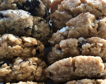 May include: A close-up of two stacks of homemade cookies. One stack is oatmeal raisin cookies and the other stack is chocolate chip cookies.
