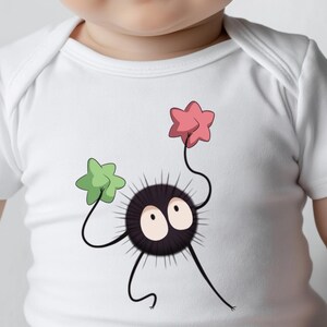 May include: White baby onesie with a black and white cartoon character holding a pink and a green star. The character has two large eyes and a spiky body.