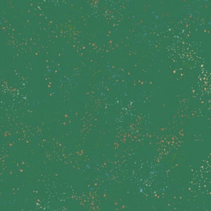 May include: A green background with a scattered pattern of small, colorful dots. The dots are in shades of blue, orange, and green.