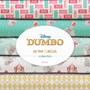 May include: A stack of five different fabric patterns featuring Disney's Dumbo the elephant. The patterns include a pink and blue ticket design, a turquoise background with stars and Dumbo flying, a striped pattern with Dumbo flying, a white background with Dumbo flying and a circus tent, and a yellow and pink diamond pattern with the word "DUMBO" repeated.