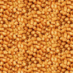 May include: A close-up image of a large pile of crispy, golden brown tater tots. The tots are arranged in a random pattern, creating a visually appealing texture.