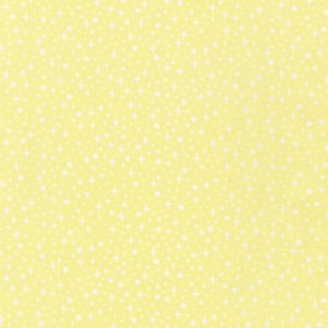 May include: A seamless pattern of pale yellow fabric with a repeating design of white dots and star shapes. The pattern is evenly distributed across the surface, creating a bright and cheerful background.