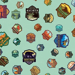 May include: A teal background with colorful illustrations of national park badges. Each badge features a different park name, location, and a unique graphic design. The badges include Yosemite, Grand Canyon, Zion, Glacier, Rocky Mountain, Shenandoah, and more.