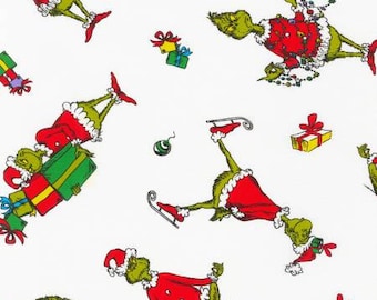 May include: A white background with a repeating pattern of green Grinch characters wearing Santa hats and holding presents. The Grinch characters are in various poses, including skating, standing, and sitting. There are also red and green Christmas ornaments and presents scattered throughout the pattern.