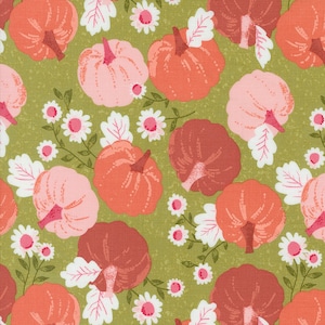 May include: A green fabric with a repeating pattern of pink, orange, and red pumpkins with white leaves and white flowers.