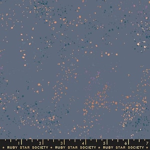 May include: A fabric with a dark blue background speckled with small, irregular dots in shades of orange, teal, and purple. The fabric has a subtle, textured appearance. The text "RUBY STAR SOCIETY" is printed at the bottom.