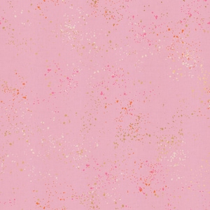 May include: Pink fabric with a speckled pattern. The fabric is a solid light pink color, with small, irregular spots of gold, white, and orange scattered across the surface. The spots vary in size and density.