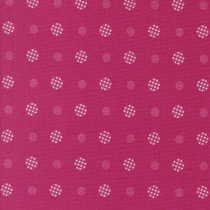 May include: A pink fabric with a white polka dot pattern. The dots are small and evenly spaced.