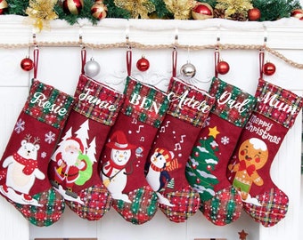 May include: Six red and green Christmas stockings with personalized names, including "Rosie", "Jamie", "Ben", "Adele", "Dad", and "Mum". Each stocking features a different embroidered design, such as a snowman, penguin, gingerbread man, and Christmas tree.