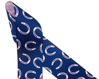 Equestrian ribbon horse shoes tossed on a navy  background for bows, gift wrap, quilting, sewing, printed on  1.5" pink grosgrain, 10 yards