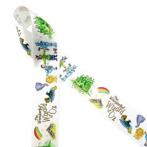 May include: White ribbon with a repeating pattern of characters and objects from the Wizard of Oz. The ribbon features the text "The Wonderful Wizard of Oz" in gold lettering.